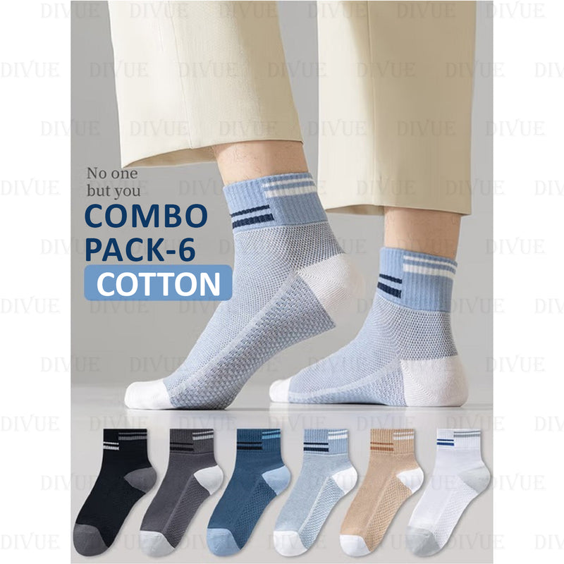 Two pairs of light blue socks with white toes and heels, worn by a person, on a light gray background. Below are six additional pairs of socks in different colors. Cotton Ankle Socks Pack of 6